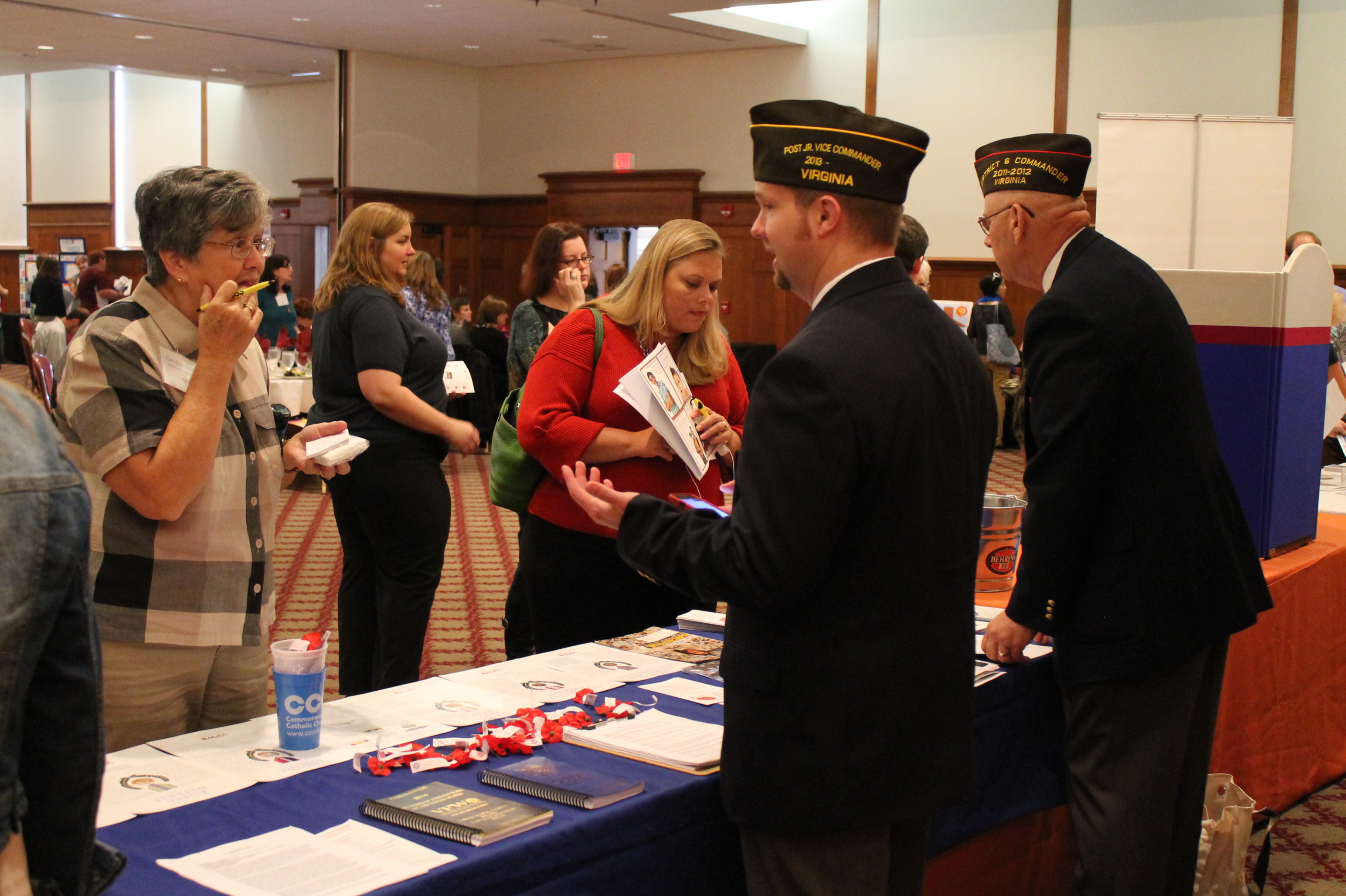 Representatives from the Veterans of Foreign Wars speak with guests at the Sept. 25, 2013, Commonwealth of Virginia Kick-off Luncheon.