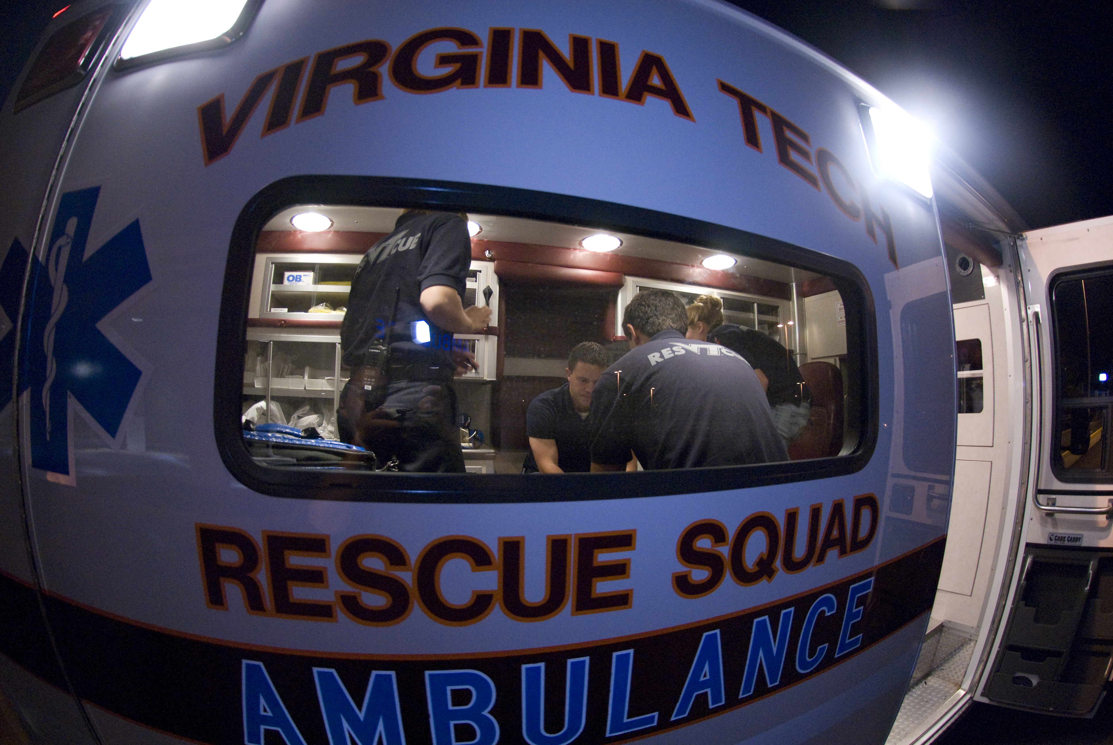 Rescue squad members in an ambulance