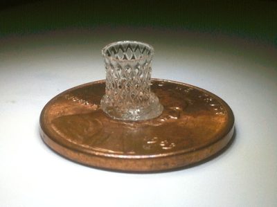 Researchers associated with the Institute for Critical Technology and Applied Science provide a genomics and informatics engine to discover the molecular properties of materials, such as this hyperboloid structure, printed here on a penny, but commonly used in construction.