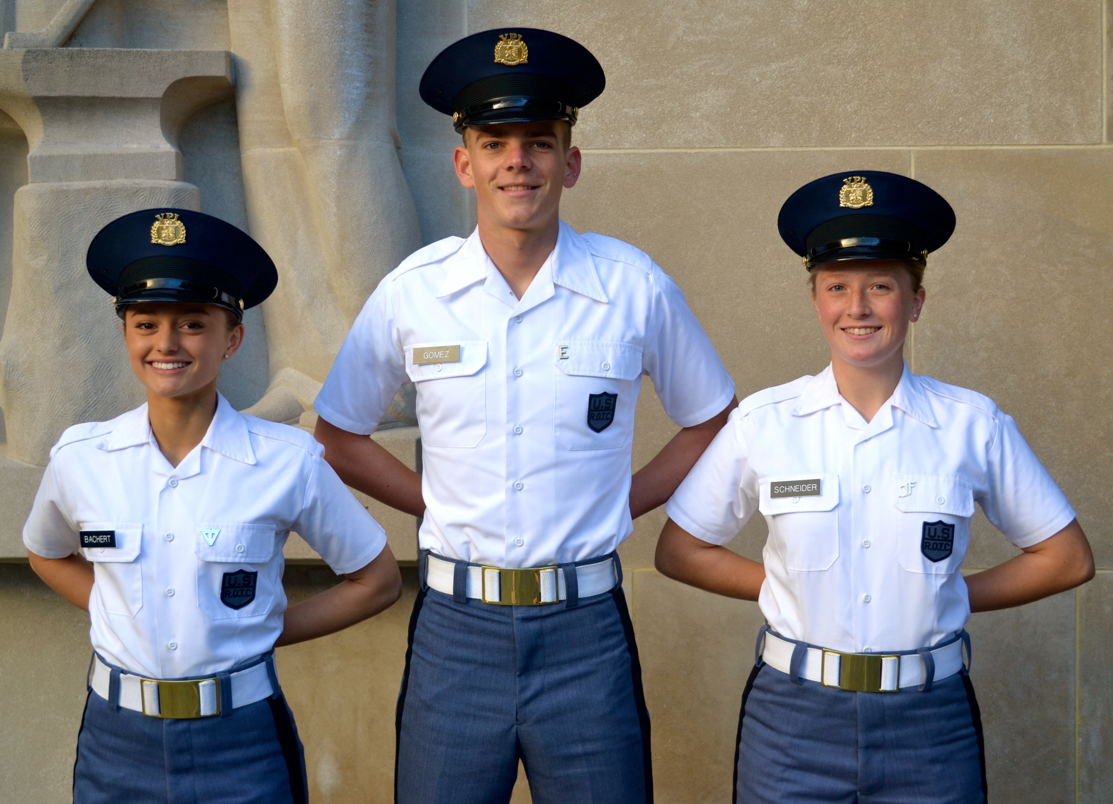 From left to right are Cadets Sabrina Bachert, Alex Gomez, and Robyn Schneider in front of the Pylons.