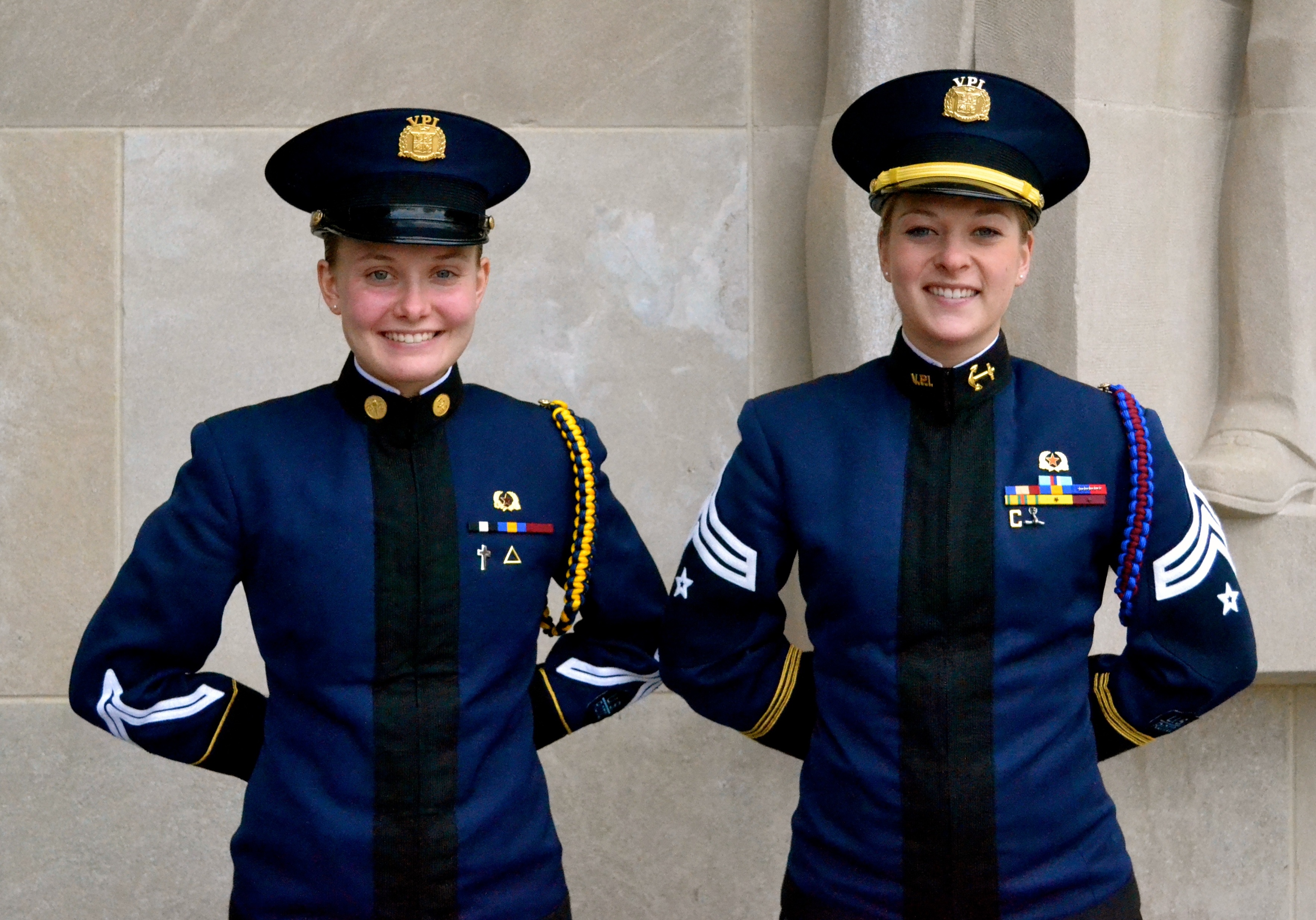 From left to right are Cadet Lindsey Bittinger and Cadet Wendy Zehner standing in front of the Pylons.