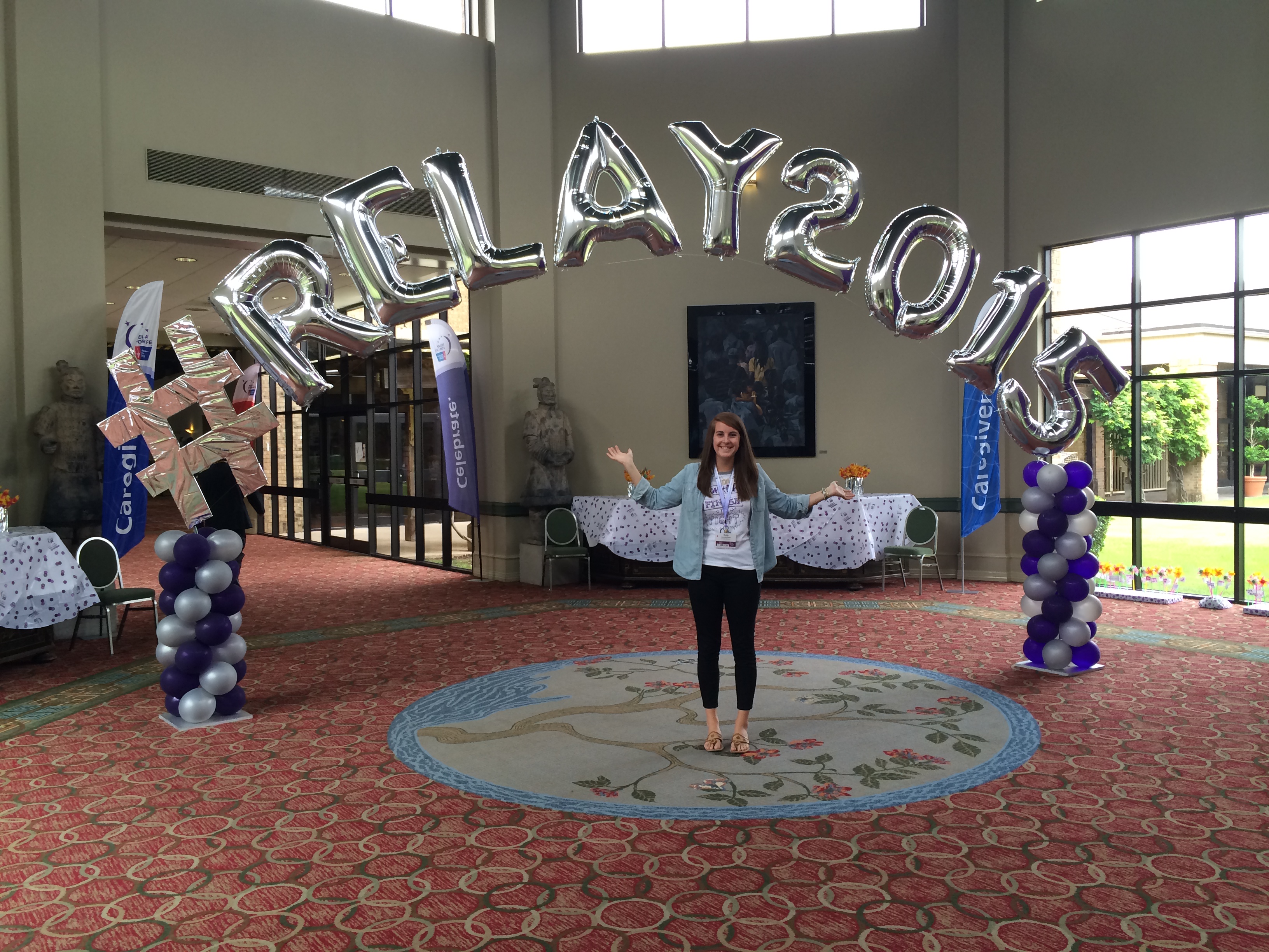 Emily McCloud, director of Relay For Life at Virginia Tech, poses with balloons that spell out #RELAY 2015.