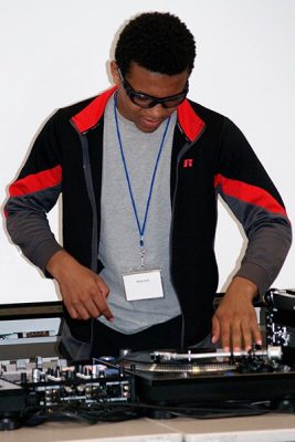 Student using DJ turntables