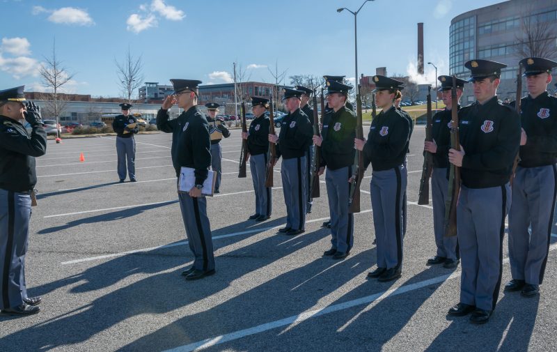 Cadet reports in to inspector during Jaffe Eager Squad Drill Competition