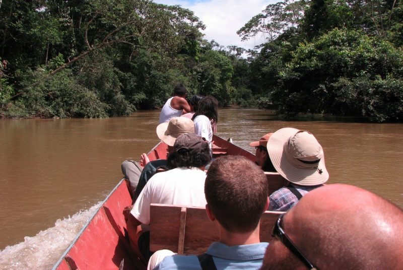 Riverboat going through rainforest