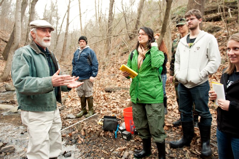 Jack Webster, at far left, holds outdoor class at stream