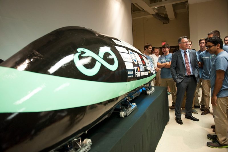President Tim Sands talks with Hyperloop team members