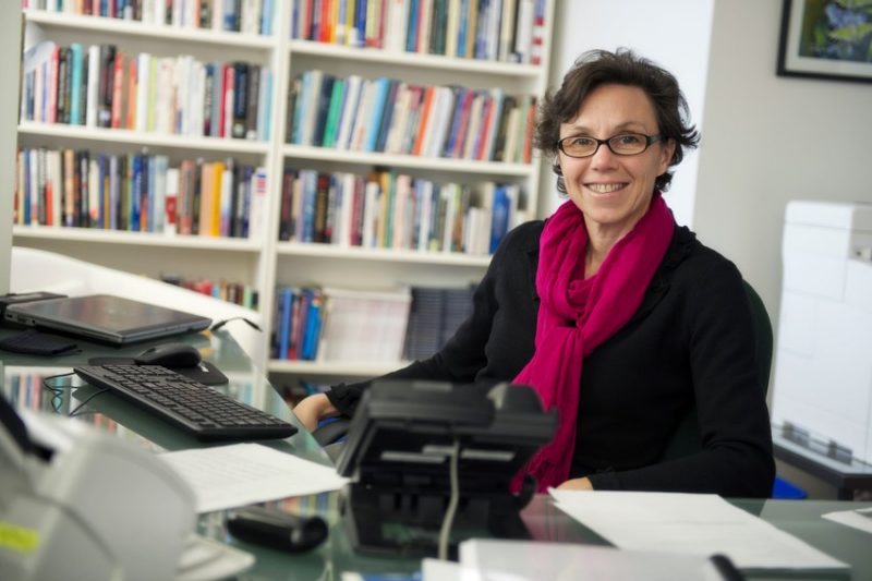 Anne Khademian behind desk in her office