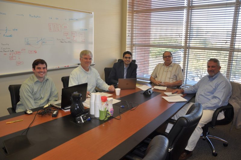Research team sitting at conference table at University of Nebraska