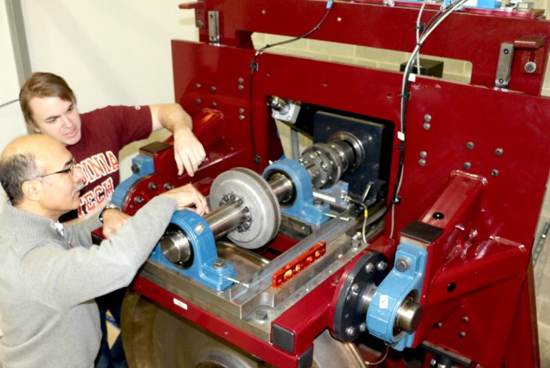 Researchers work on the Railway Technologies Laboratory roller rig