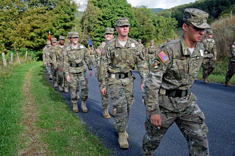 Cadet Izzy Goschinski, fourth from right, marches down the road with her company.