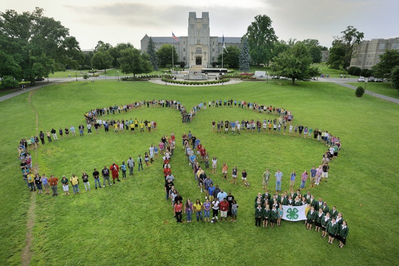4-H members form a shamrock on the Drillfield