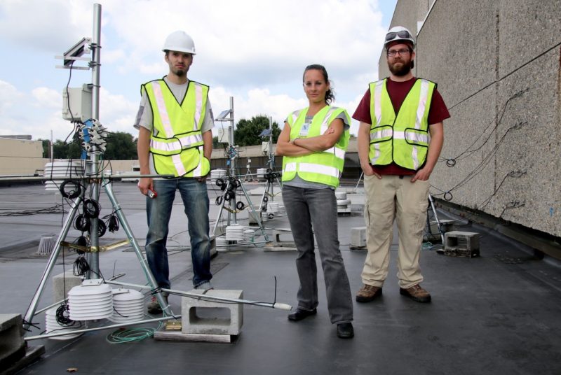 Elizabeth Grant and student researchers on roof.