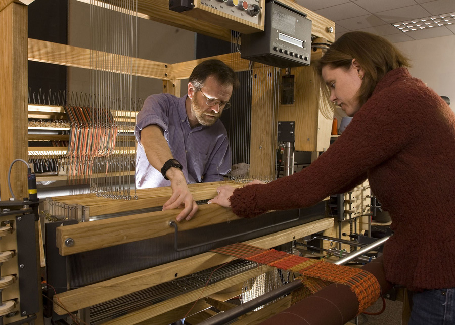Martin and student Meghan Quirk weaving e-textiles
