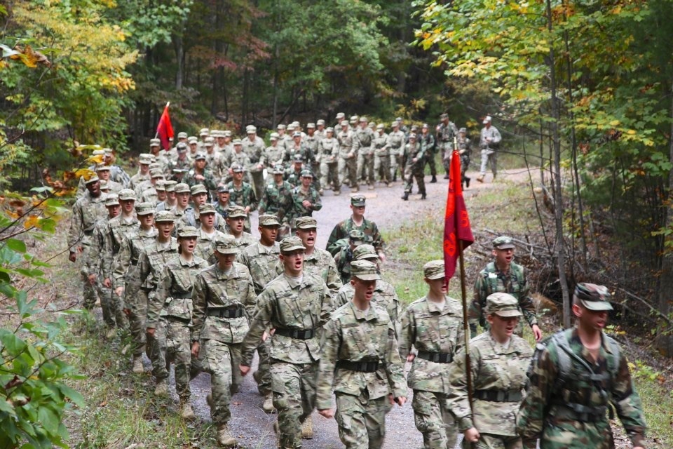 Members of the Class of 2016 march together through the woods on the Fall Caldwell March last September.