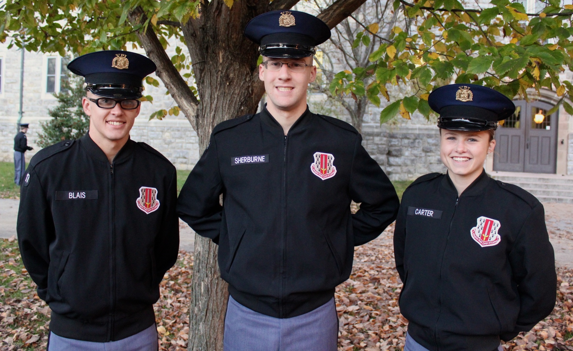 From left to right are Cadets Chas Blais, Michael Sherburne, and Amanda Carter in the Eggleston Quad.