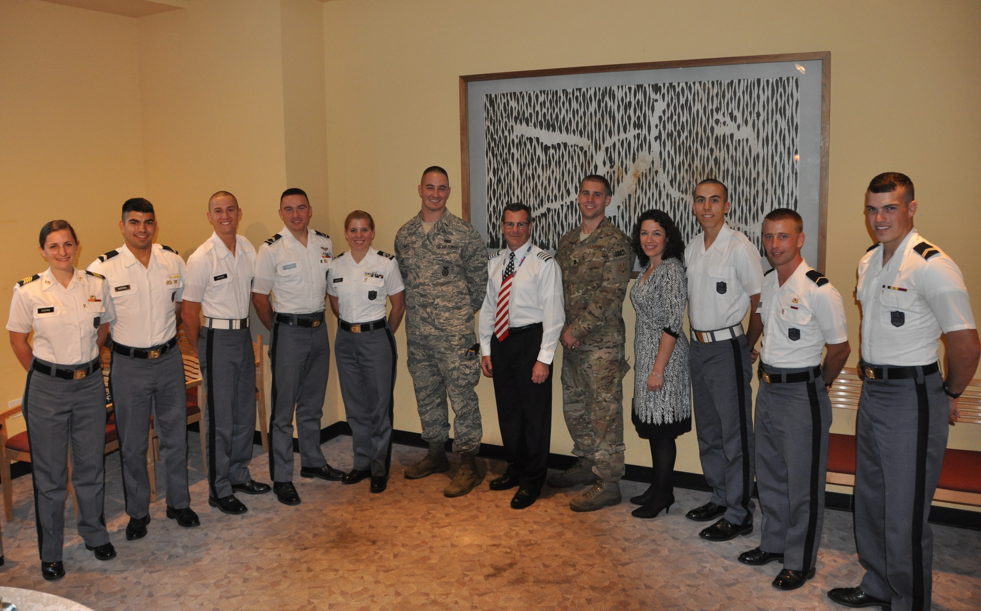 Cadets stand with the visiting Fall 2013 Gunfighters at the reception following the panel.