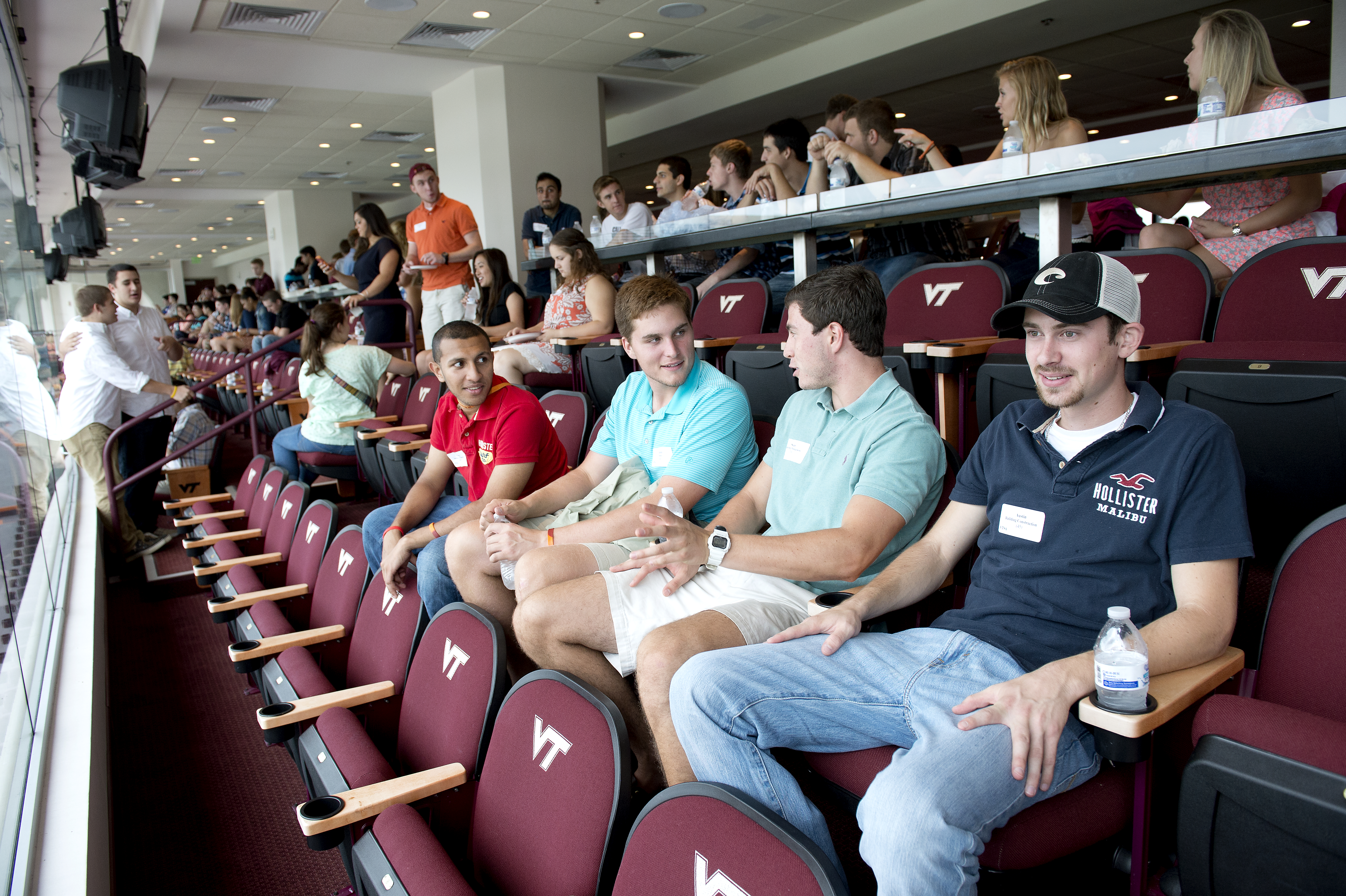 Summer academy students enjoy pizza in the President's Box in Lane Stadium