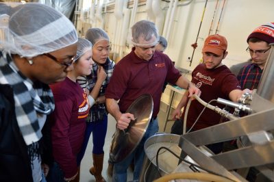 One of the pilot plant managers, Herbert Bruce, and students check a batch of beer in the brewhouse. The recently installed 2.5 hectoliter, professional-grade Esau & Hueber was designed so breweries can develop new varieties of ales and lagers while researching new, locally sourced ingredients without having to take their own facilities off-line.
