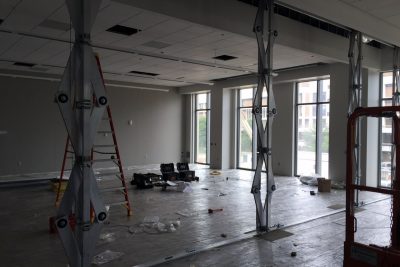Crews are installing a "skyfold" in a classroom, which is a sound control partition allowing classrooms to be divided when needed.