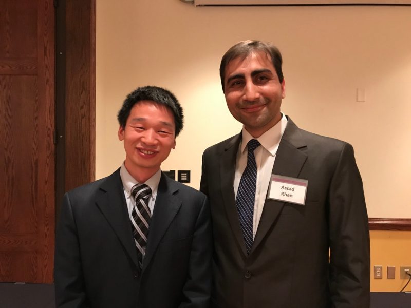 Assistant Professor Greg Lui and Graduate student of the year Assad Khan in business suits at the awards banquet