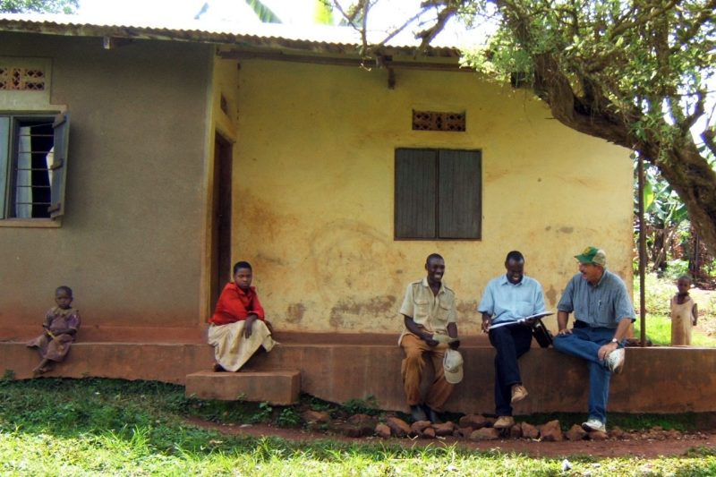 Ohio State researcher, right, with professor, farmer and children in Uganda