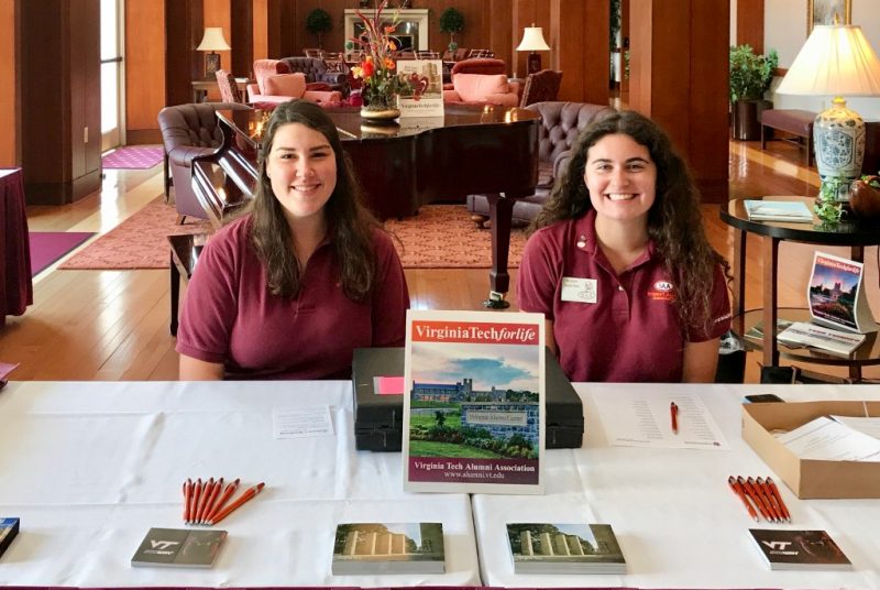 Seniors Kelsey Rosenbaum (left) and Alexa Amster manned the check-in table for Women's Weekend as part of the Student Alumni Association.