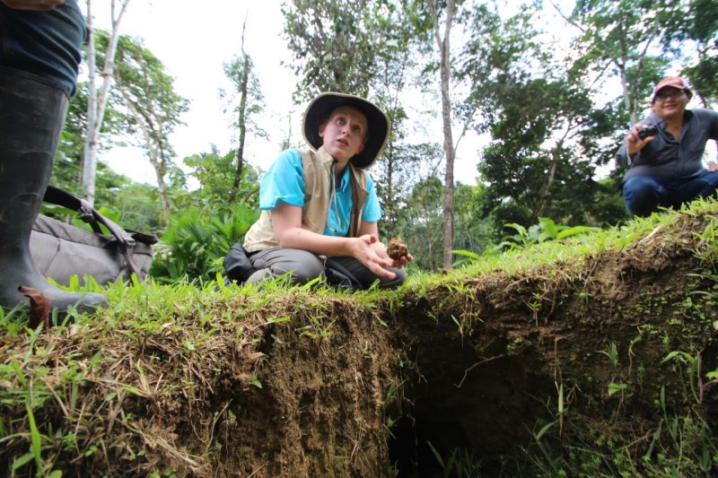 Elizabeth Gray shows Ecuadorian college students how to do a soil survey. 