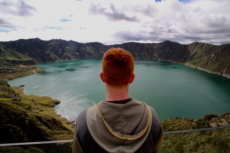 Matt Dennis looks out into the crater lake at the Quilotoa volcano.