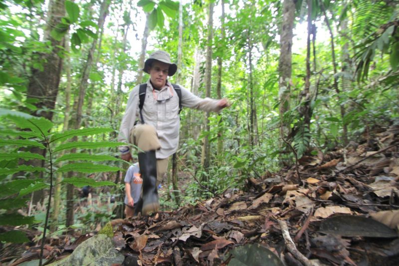 Lester Schonberger  trekking through the Amazon. 