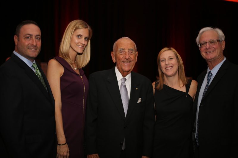Howard Feiertag poses with four family members.
