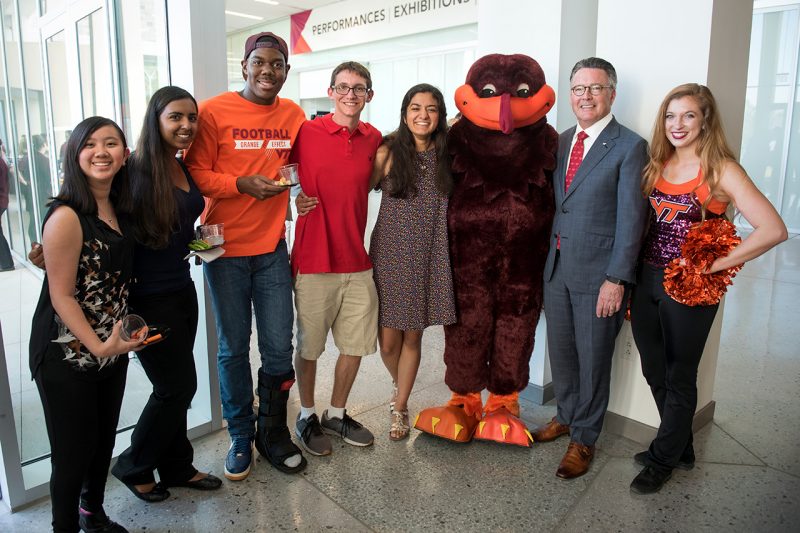President Sands with the Hokiebird and several students at the 2017 State of the University in September. 