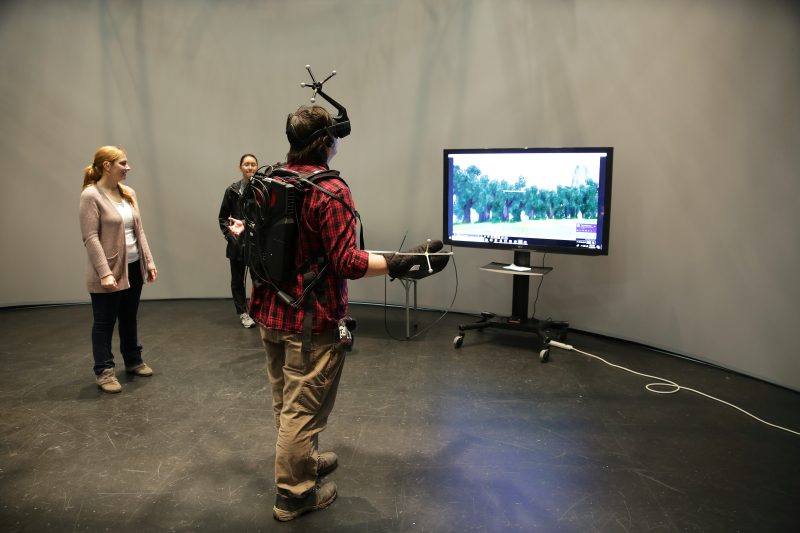 Students suit up and play the motion capture game created by Team T-Rex. 