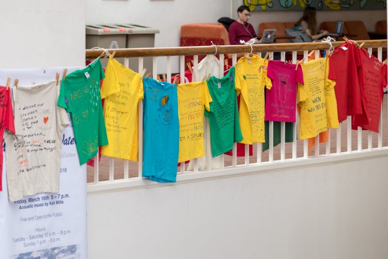 T-shirts for the Clothesline Project are displayed at Squires Student Center