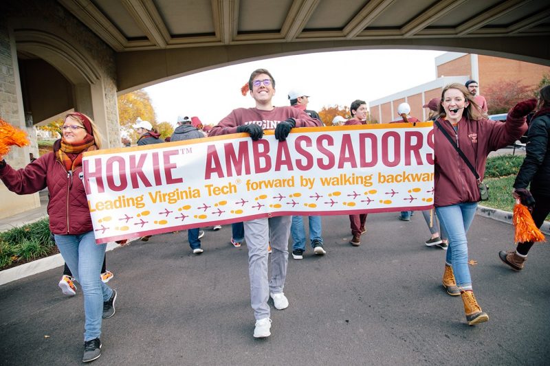 Hokie Ambassadors walk together in the 2018 Homecoming parade