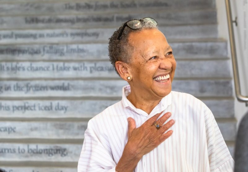 Nikki Giovanni stands in front of the poetry steps at the Moss Arts Center.