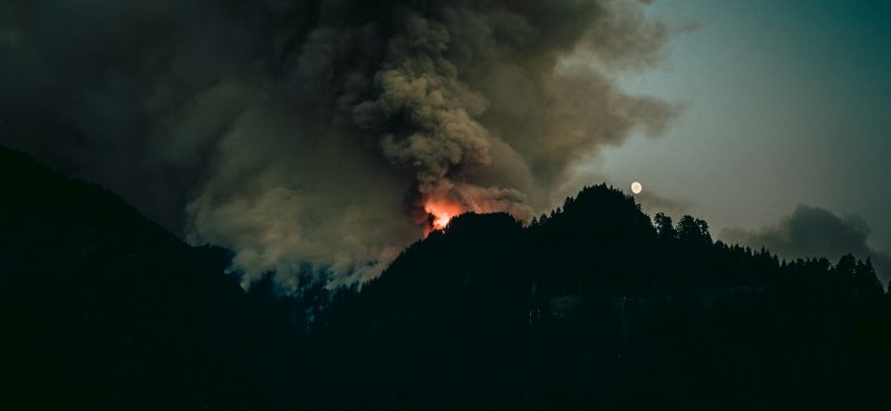 A wildfire burning on a mountain
