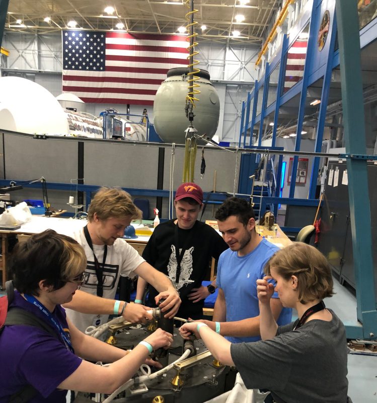 Members of the HokieNauts work at the Johnson Space Center.