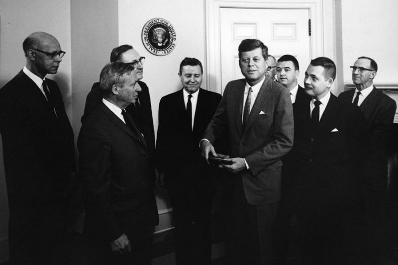 In a White House ceremony on April 17, 1962, members of the United States Civil War Centennial Commission present a special Centennial medallion to President John F. Kennedy. James I. “Bud” Robertson Jr., then executive director of the commission, stands just to Kennedy’s left (second from right in the photo).