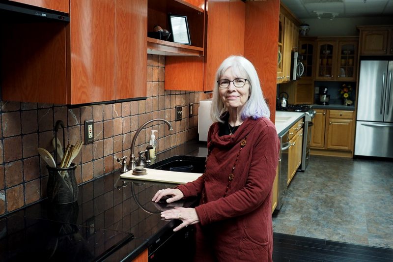 Kathleen Parrott standing at a counter in a kitchen