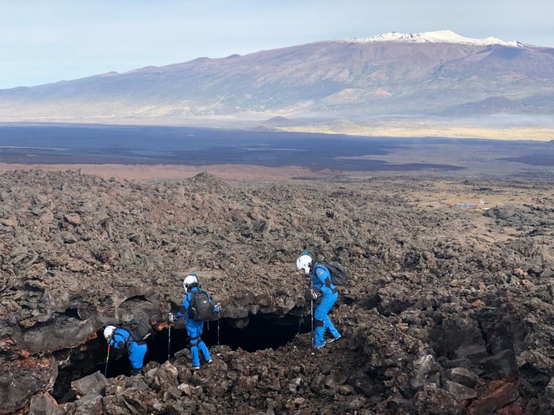Erin Bonilla '04, leads her Sensoria crew mates in exploring a lava tub at the Hawaii Space Exploration Analog and Simulation (HI-SEAS) habitat. Photo by Sian Proctor.