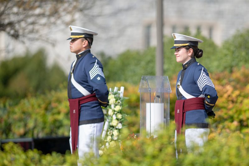 Members of the Virginia Tech Corps of Cadets stand near the memorial candle during the 2019 Day of Remembrance activities. 