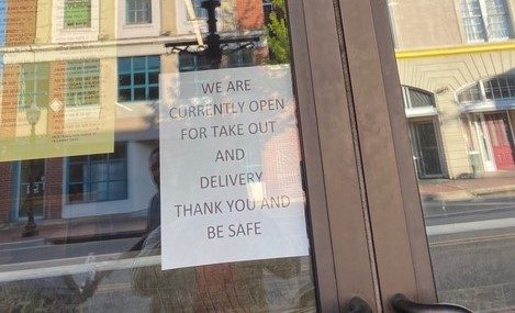 image of sign that says:  We are currently open for takeout and delivery. Thank you and be safe.