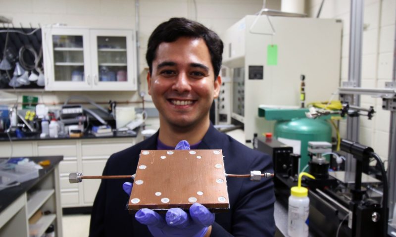 Lab member  Mojtaba Edalatpour shows the thermal diode developed by Boreyko's team.