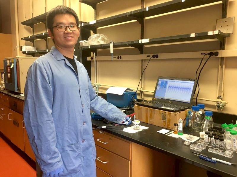 Anyang Hu, a graduate student in chemistry, poses for a photograph in a North Hahn Lab, before the COVID-19 pandemic occurred..