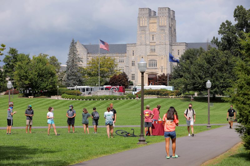 Students cross the Drillfield on the first day of class. 
