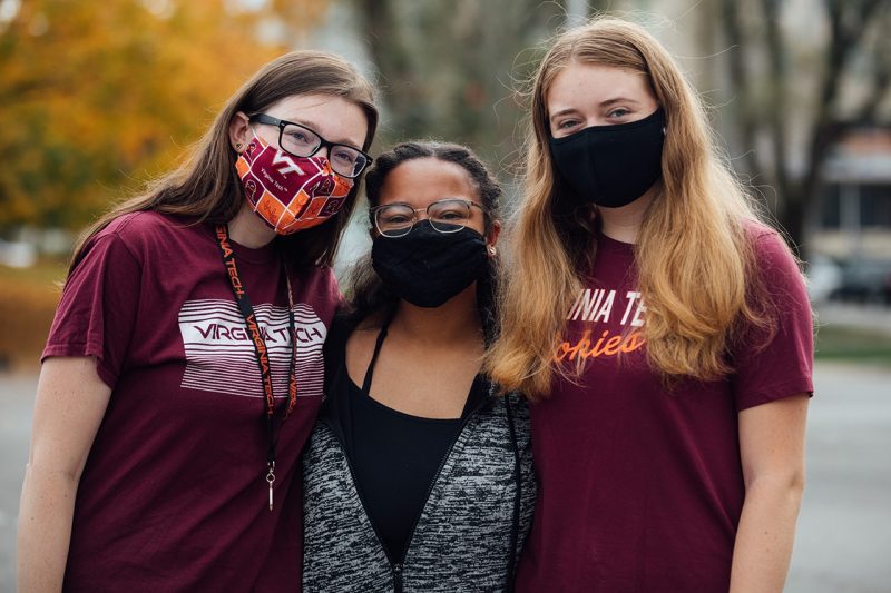 Three students in masks at Fall Fest 