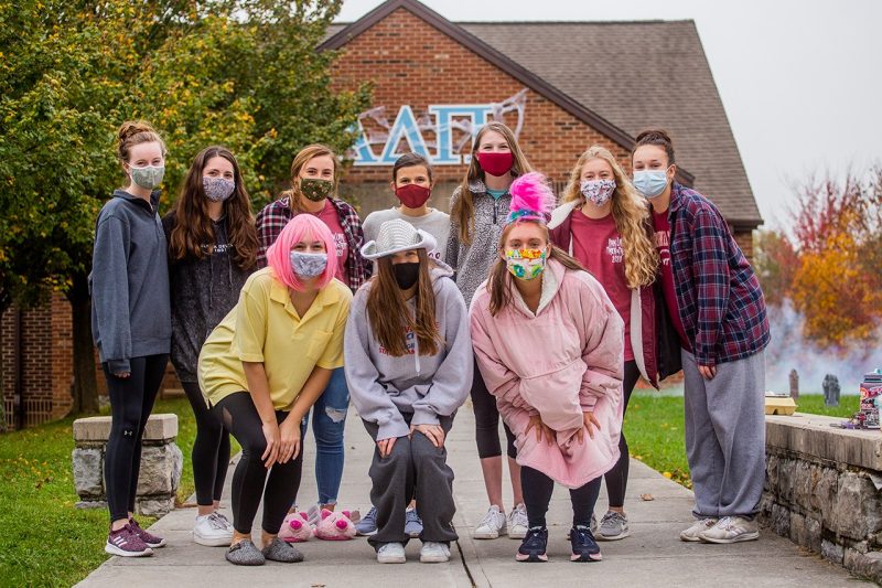 Students wearing masks at the costume caravan at Oak Lane