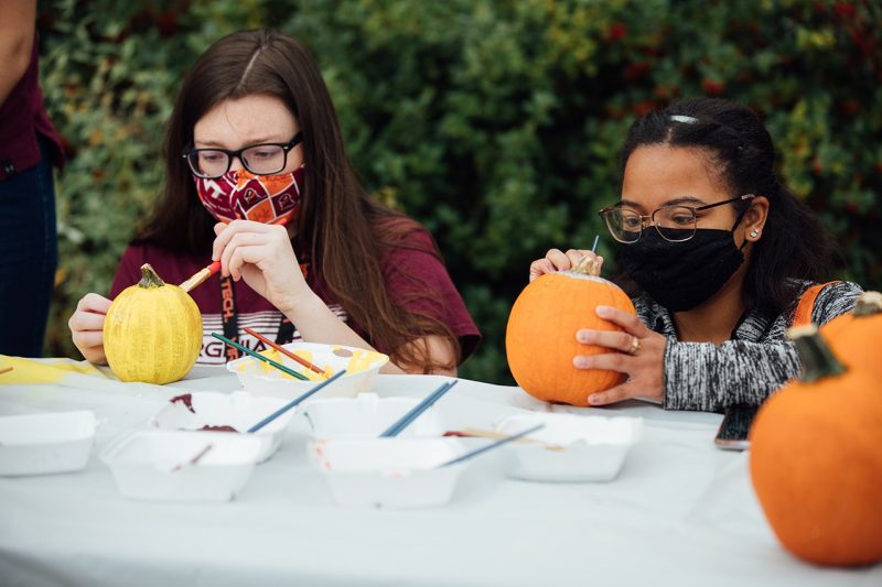Students paint pumpkins