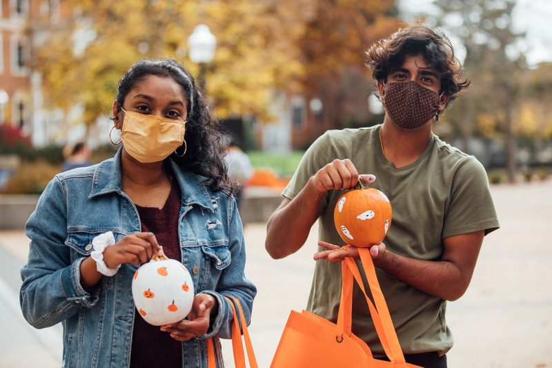 Students show off their painted pumpkins